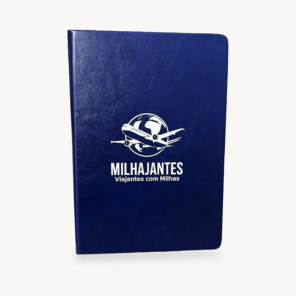 Caderno de couro azul-marinho com o logo Milhajantes impresso em branco em Digital UV